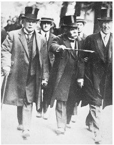 President Wilson (far right) strolls with David Lloyd George of Great Britain (far left) and Georges Clemenceau of France during the Paris Peace Conference following World War I. ARCHIVE PHOTOS