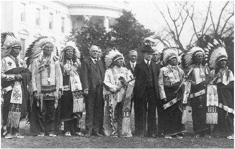 President Calvin Coolidge (wearing hat) welcomes representatives of the Sioux tribe to the White House in 1925. THE LIBRARY OF CONGRESS